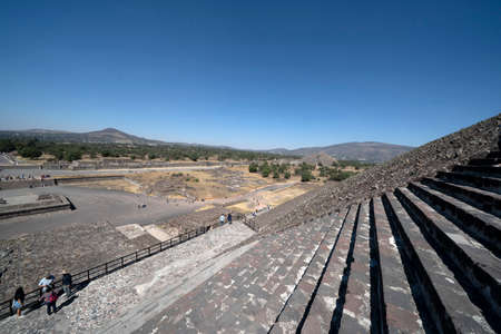 MEXICO CITY, MEXICO - JANUARY 30 2019 - Tourist climbing Teotihuacan pyramid ancient ruins one of the country most famous and visited archeological sitesのeditorial素材