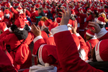 GENOA, ITALY - DECEMBER 22 2019 - Traditional Santa claus walk more than 2,000 people christmas dressed walking in town centerのeditorial素材