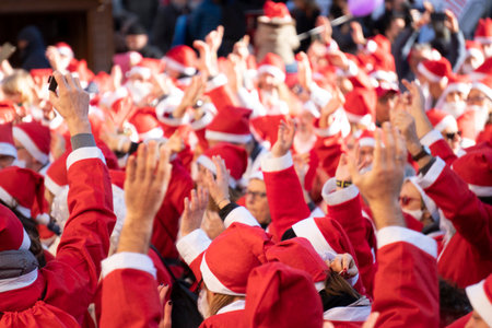 GENOA, ITALY - DECEMBER 22 2019 - Traditional Santa claus walk more than 2,000 people christmas dressed walking in town centerのeditorial素材