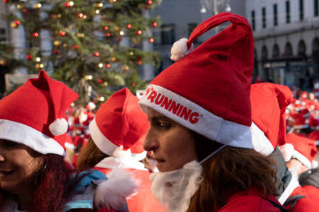GENOA, ITALY - DECEMBER 22 2019 - Traditional Santa claus walk more than 2,000 people christmas dressed walking in town centerのeditorial素材