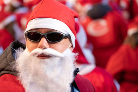 GENOA, ITALY - DECEMBER 22 2019 - Traditional Santa claus walk more than 2,000 people christmas dressed walking in town centerのeditorial素材