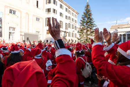 GENOA, ITALY - DECEMBER 22 2019 - Traditional Santa claus walk more than 2,000 people christmas dressed walking in town centerのeditorial素材
