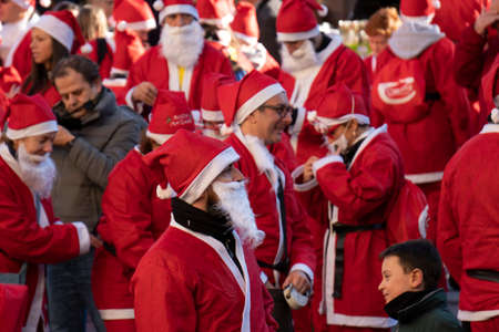 GENOA, ITALY - DECEMBER 22 2019 - Traditional Santa claus walk more than 2,000 people christmas dressed walking in town centerのeditorial素材