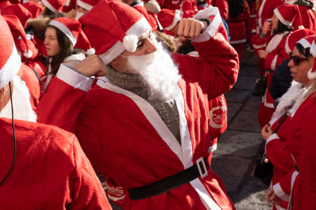 GENOA, ITALY - DECEMBER 22 2019 - Traditional Santa claus walk more than 2,000 people christmas dressed walking in town centerのeditorial素材
