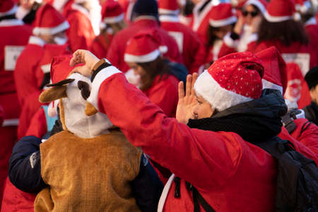 GENOA, ITALY - DECEMBER 22 2019 - Traditional Santa claus walk more than 2,000 people christmas dressed walking in town centerのeditorial素材