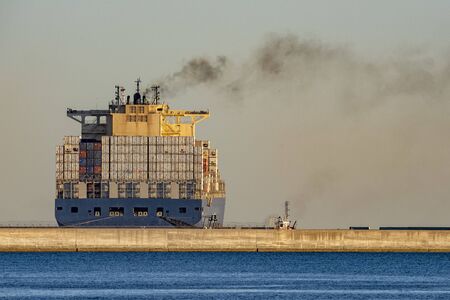 Container ship while docking in genoa harbor Italyの写真素材