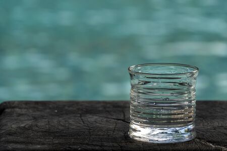 drink glass on pool background in seychellesの写真素材