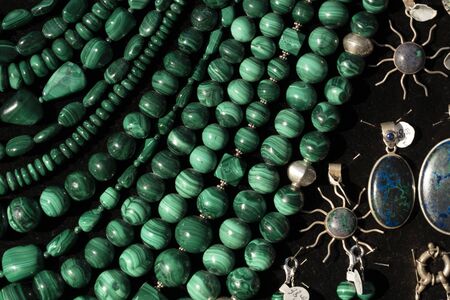 Malachite necklage earrings jewelry on display stand in a shop market detailの写真素材