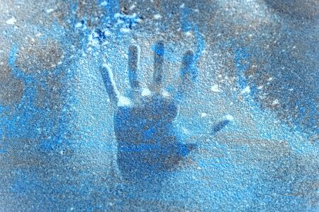 hand handprint on frozen ice detailの写真素材