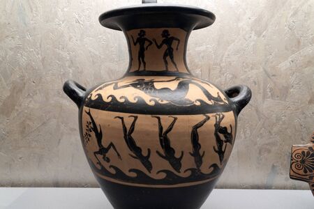 Swimmer morphing to dolphin greek vase detailの写真素材