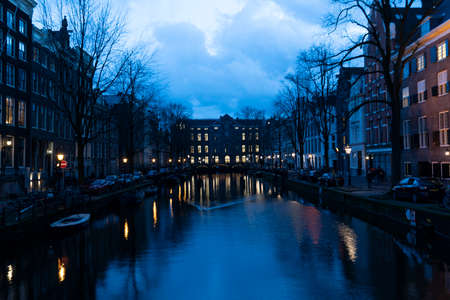 AMSTERDAM, NETHERLAND - FEBRUARY 25 2020 - The medieval city canals cross town center leaving today main red-light district for legalのeditorial素材