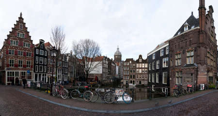 AMSTERDAM, NETHERLAND - FEBRUARY 25 2020 - The medieval city canals cross town center leaving today main red-light district for legalのeditorial素材