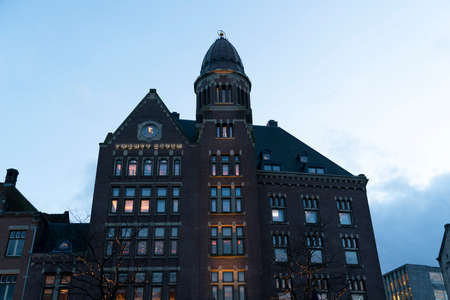 AMSTERDAM, NETHERLAND - FEBRUARY 25 2020 - The medieval city canals cross town center leaving today...