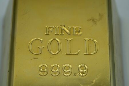 Gold ingot isolated close up