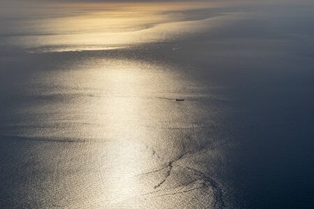 airplane panorama at sunrise by the sea destination
