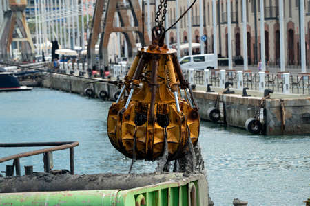 Harbor port dredge working on sea detailの写真素材