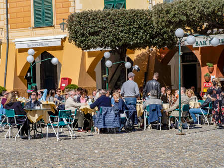 PORTOFINO, ITALY - MARCH 14 2021 - Pictoresque Italian Village crowded the last day before lockdown place and restaurants are fullのeditorial素材
