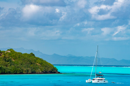sailboat in Bora Bora blue lagoon French Polynesia andscapeの写真素材
