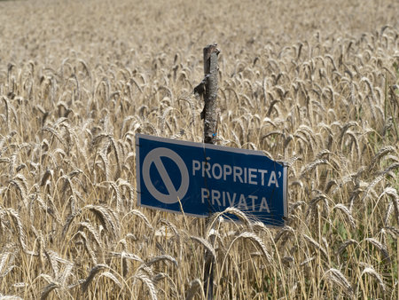 private proprety sign in a mature wheat field ready to harvest detailの写真素材