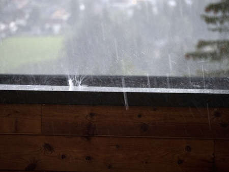 hailstorm on balcony in mountain detail of hailstones while falling