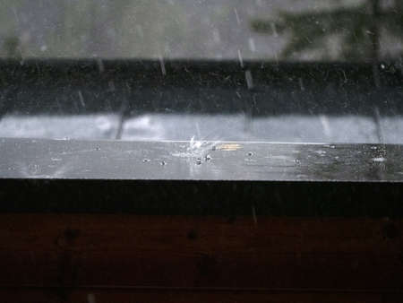 hailstorm on balcony in mountain detail of hailstones while falling