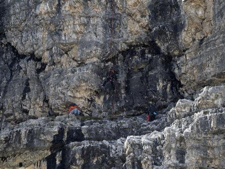 Climbing under the rain in three peaks of Lavaredo dolomites mountains panoramaの写真素材