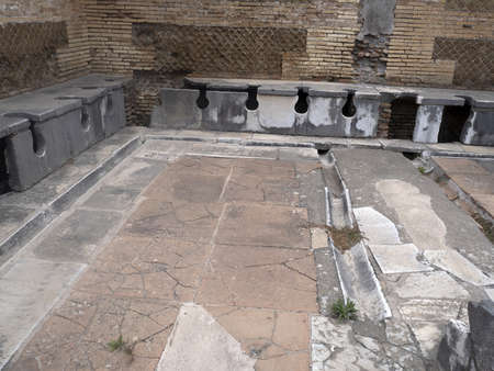 public toilet wc old ancient ostia archeological site ruinsの写真素材