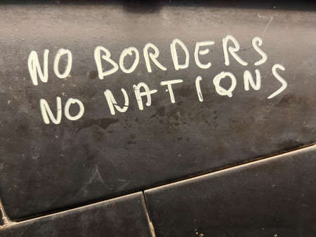 no borders no nations writing sign on a wallの写真素材