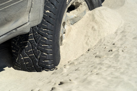 Car tire shelved in sand 4x4の写真素材