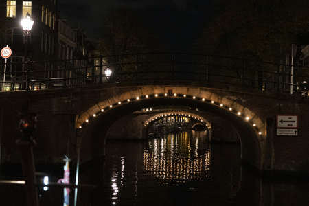 amsterdam netherlands canals cruise at nightの写真素材