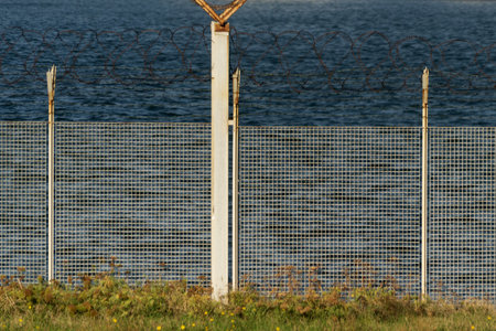 by the sea barbed wire fence detail