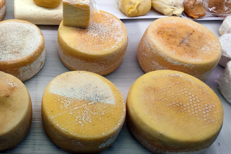 Natural hand made organic italian cheese at the marketの写真素材