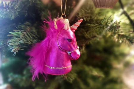 Pink unicorn glass christmas ball on xmas tree detail artisanal hand made