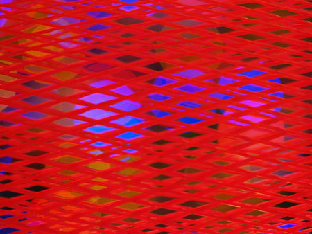 Christmas xmas candles on the table inside red platic netの写真素材