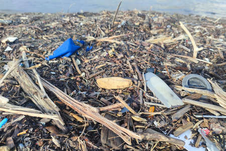 Plastic waste rubbish garbage on the sandy beachの写真素材