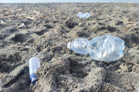 Plastic waste rubbish garbage on the sandy beach