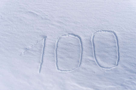 100 number writing on the snow detail one hundredの写真素材