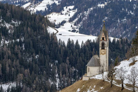 The valley La val dolomites mountain church in winter view landscape panoramaの写真素材