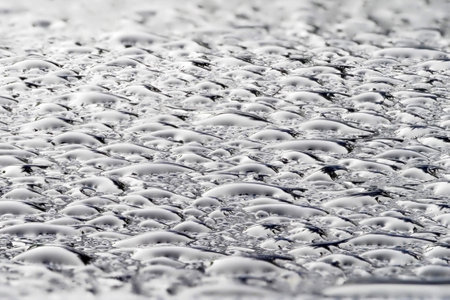 rain drops on blue metal close up macro detail