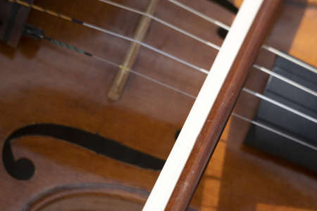playing violin string bow close up detail