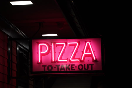 pizza to take out neon sign on blackの写真素材