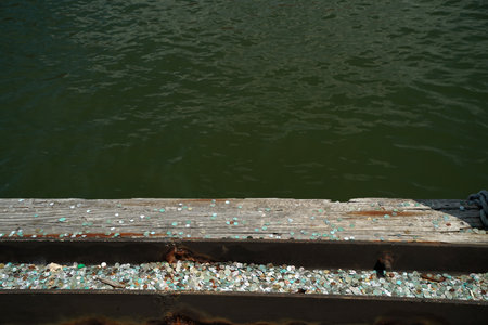 many dime coin dollar money on liberty island ferry pier wharf new york cityの写真素材