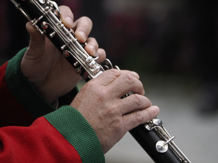 hands playing clarinet detail in a band