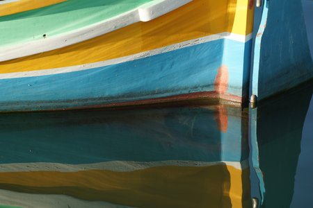 malta colorful painted fishing boat in marsaxlokk harborの写真素材