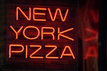 new york pizza red neon sign on blackの写真素材