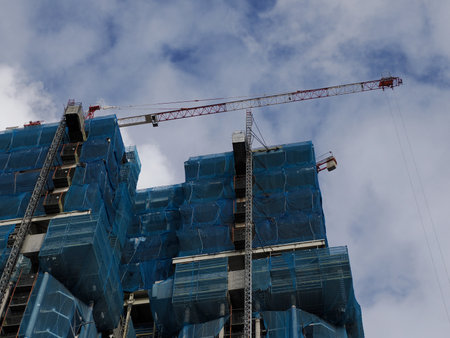 skyscraper Colon Towers under renovation in Plaza of Colon in Madrid blue skyの写真素材