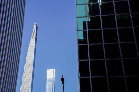 new york city manhattan skyscrapers view from the street to the top of the building on sunny clear dayの写真素材