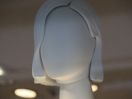 A Female mannequin in shop window. woman Head dummy shows fashionable clothes