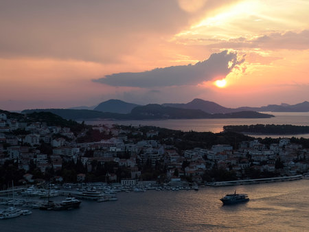a red sunset over Dubrovnik Croatia medieval townの写真素材