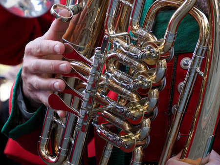 hand detail playing traditional band instrument close upの写真素材